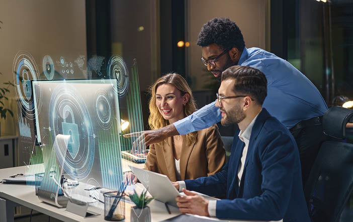 Three people are sitting at a desk, looking at a computer screen. One man is pointing at the screen, while the other two are engaged in the content. They are all dressed in business attire, with one person wearing a tie. The scene appears to be a professional setting, possibly a meeting or a presentation. AI generated content