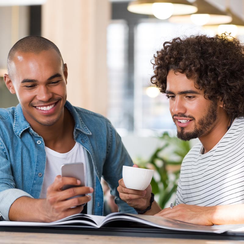 digital-publications-2-young-men-with-magazine-and-phone