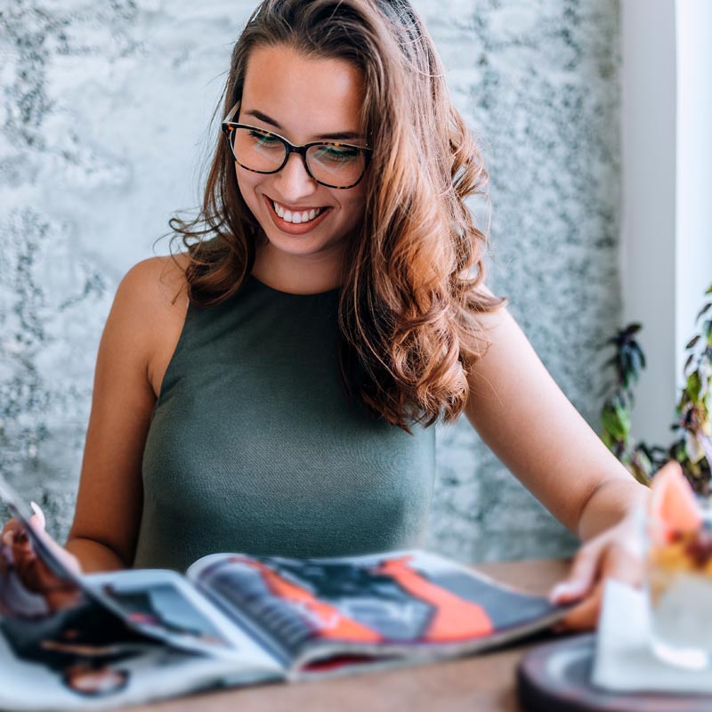 print-publications-young-woman-reading-magazine